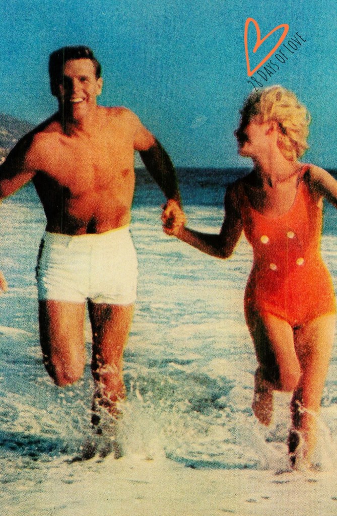 Couple in swimsuits chase waves on California Beach - Good Housekeeping January 1963