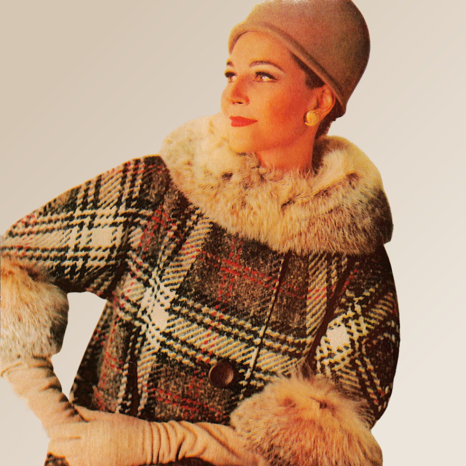 Model wearing a plaid coat with fur collar and cuffs