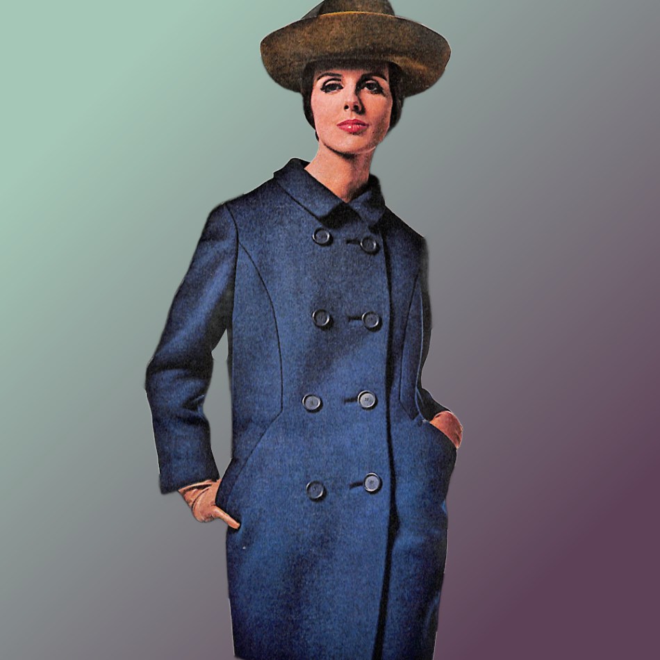 Model wearing hat and Navy Double Breasted Zelinka Matlick coat