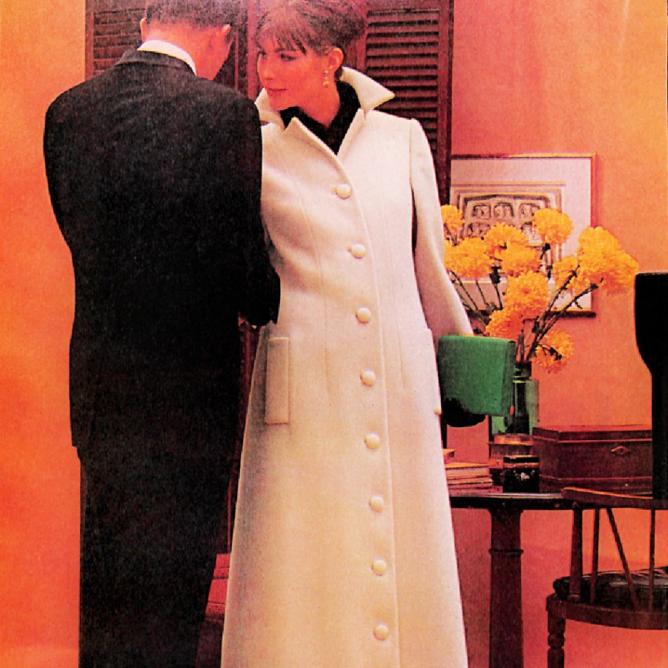 Beige Murray Neiman maxi coat buttoned all the way to the floor.