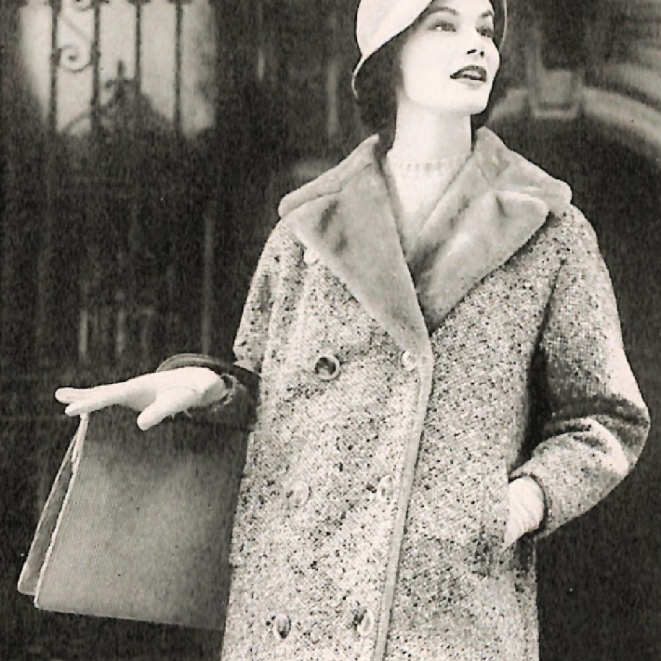 1950s woman wearing a double-breasted tweed coat lined in fur