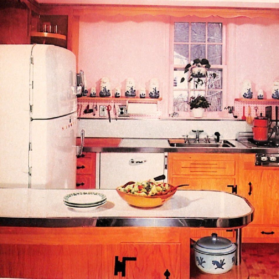 Vintage kitchen with pink walls and wood cabinets