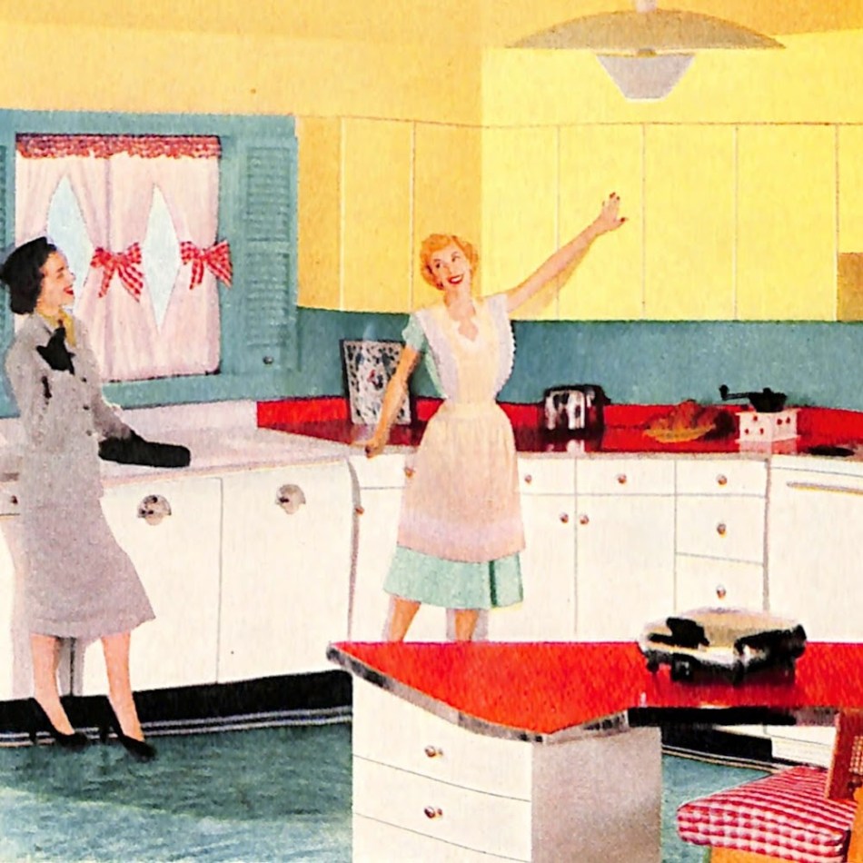 Vintage housewife showing off her freshly-painted yellow cabinets to a friend.